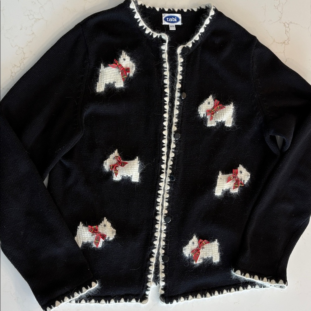 Festive Scottie Dog cardigan sweater. 
With tartan bows and dogs of Lambswool.